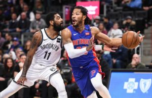 Jan 25, 2020; Detroit, Michigan, USA; Detroit Pistons guard Derrick Rose (25) drives to the basket against Brooklyn Nets guard Kyrie Irving (11) during the first quarter at Little Caesars Arena. Mandatory Credit: Tim Fuller-USA TODAY Sports