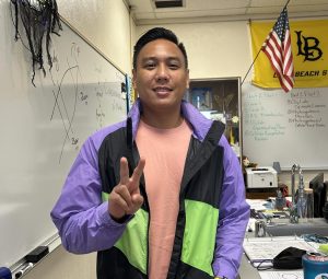 Mr. Trinidad poses in his classroom